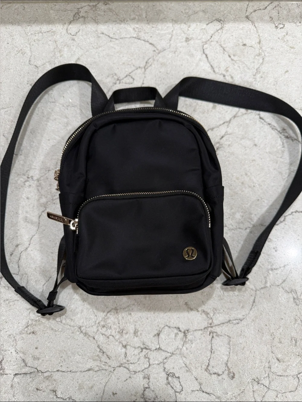 lululemon athletica Black Mini Backpack with Gold Accents. new without tags